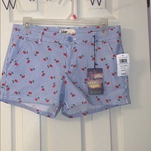 Blue and white striped shorts with cherry design